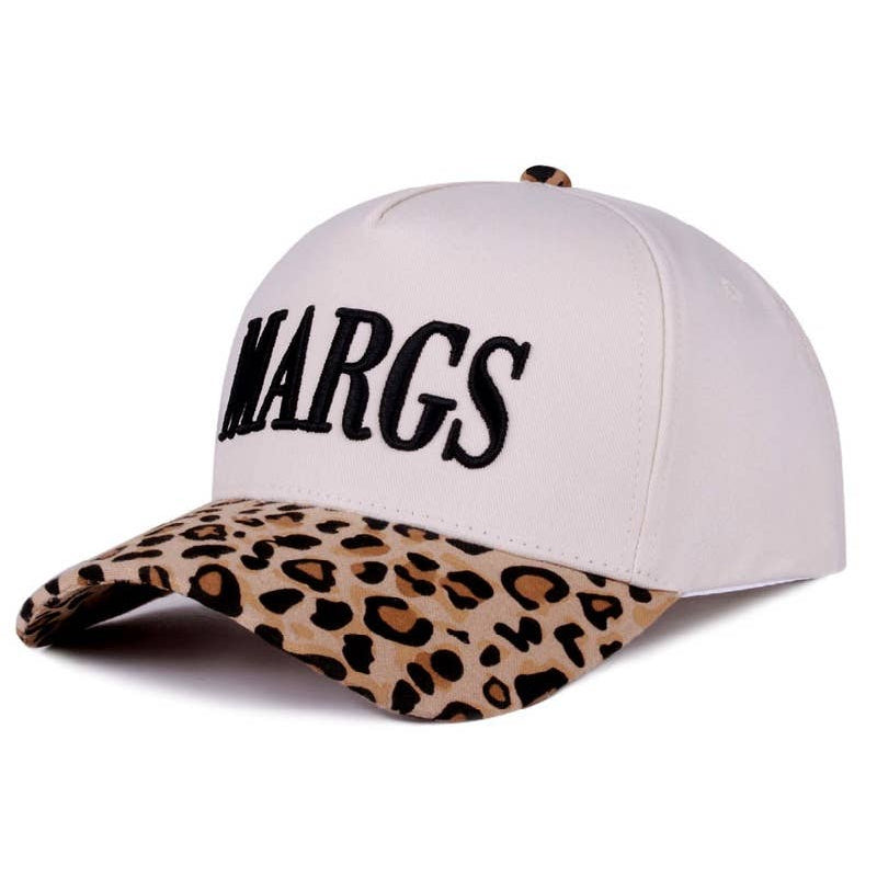 White cap with leopard print brim and 'MARGS' text on a white background