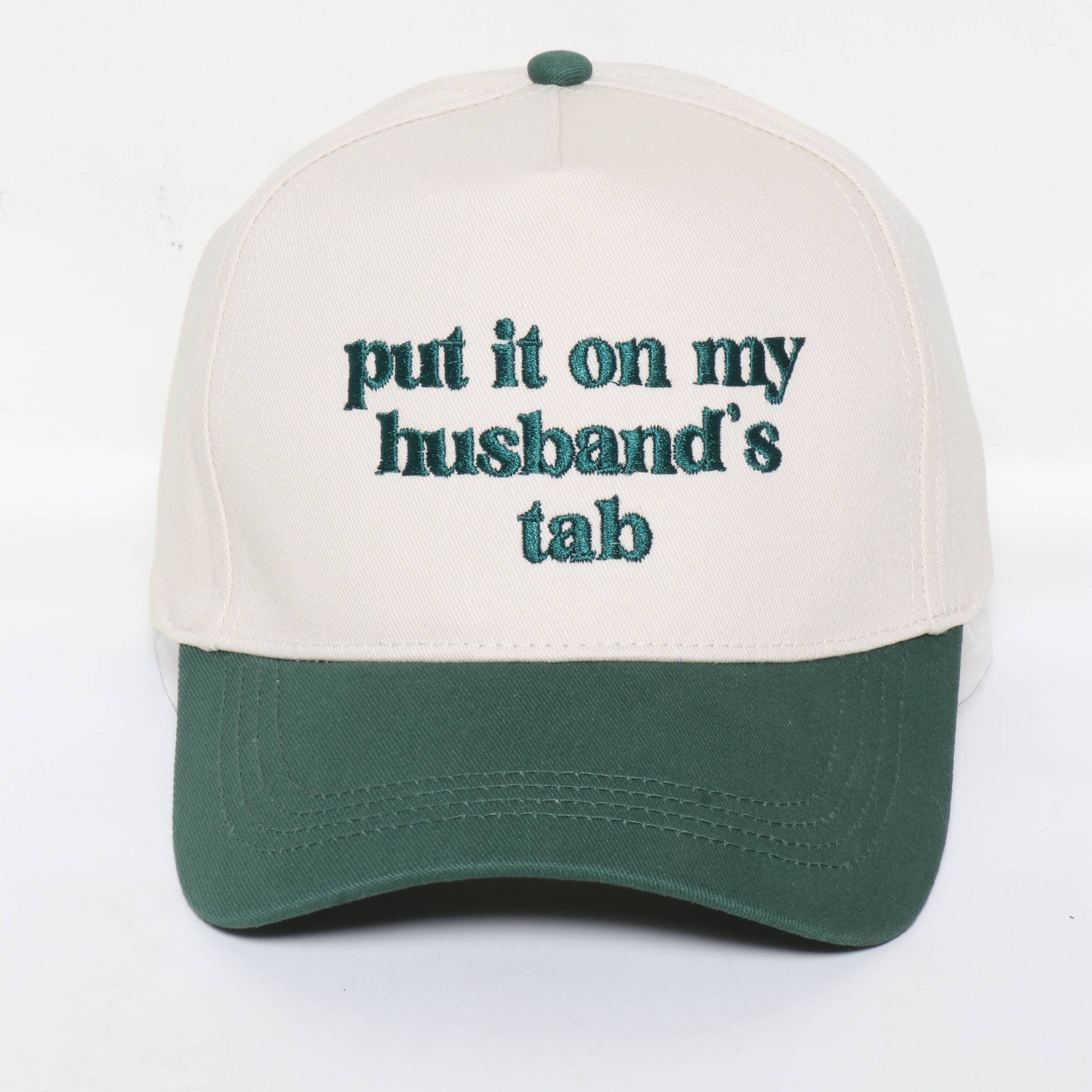 Cap with text 'put it on my husband's tab' on a white background